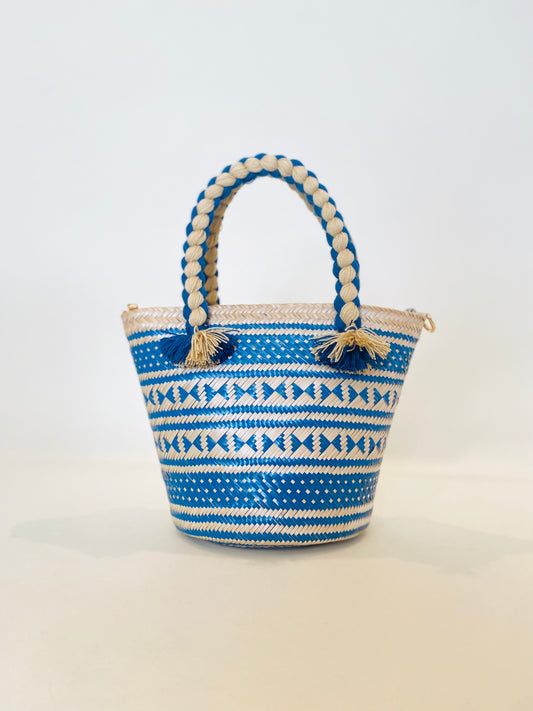 The Cartagena Bag detail - woven straw top handle bag with gold zipper hardware